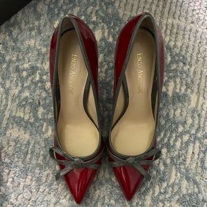 Enzo Angolini red heels with bow. Only worn a few times.